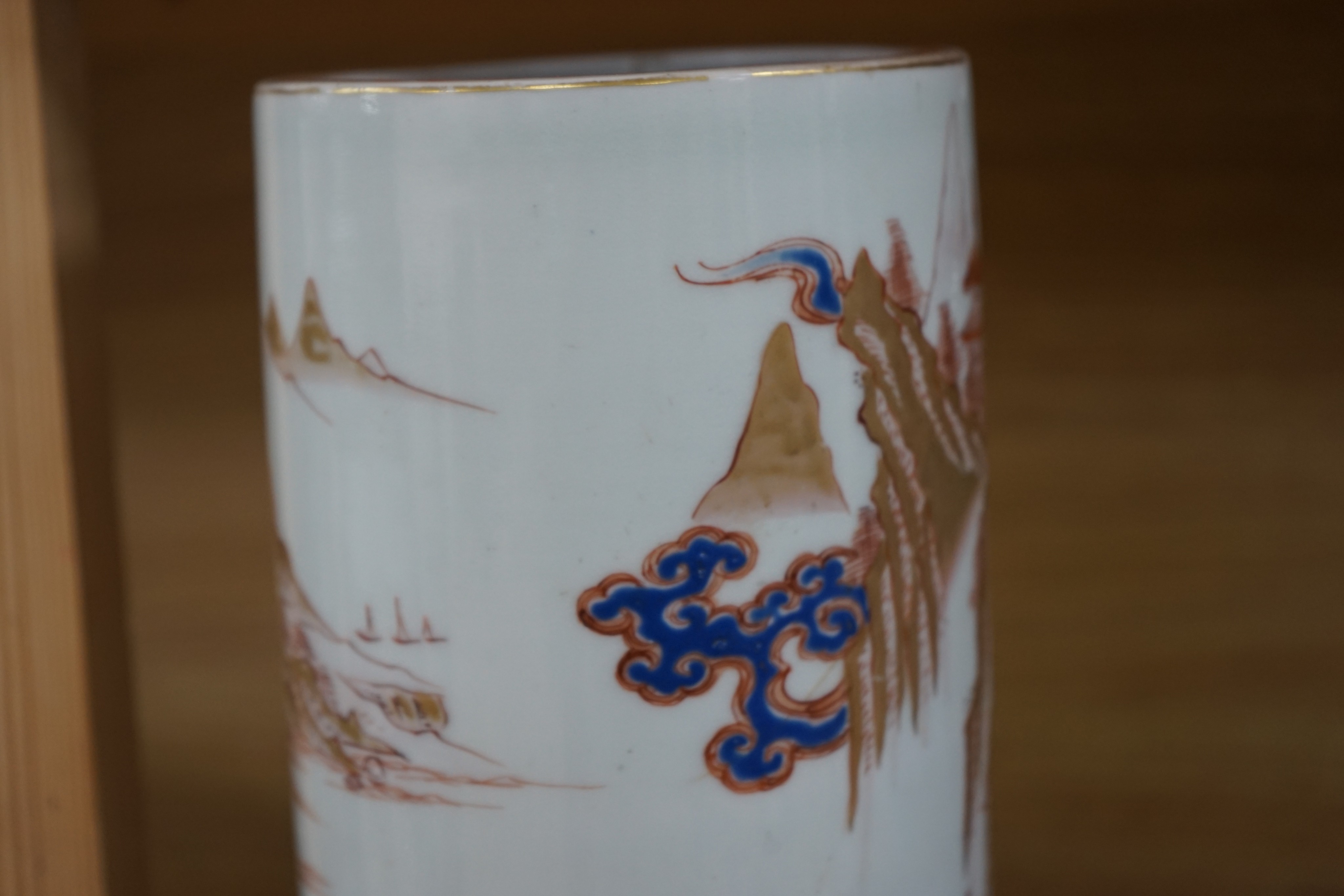 A Japanese porcelain cylindrical vase and a Chinese yellow ground two-section vessel and cover, 29cm